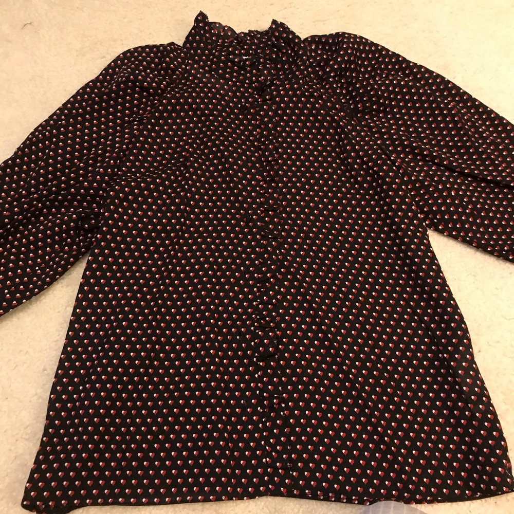 Black blouse with red & off white. Ruffle details
